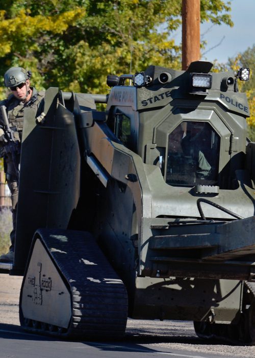 jt111017a/a sec/jim thompson/ NM State Police officers and the Rook with it's battering ram head into Village Park Mobile Home park. The State Police SWAT officers were called in after an BCSO officer involved shooting at the trailer park.  Friday,Nov.10, 2017. (Jim Thompson/Albuquerque Journal)